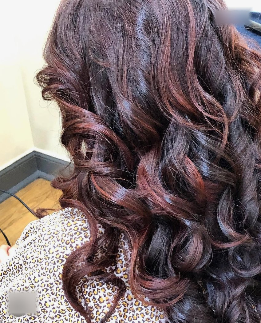 Dark burgundy curls colored and styled by Angelica, Tarrytown NY